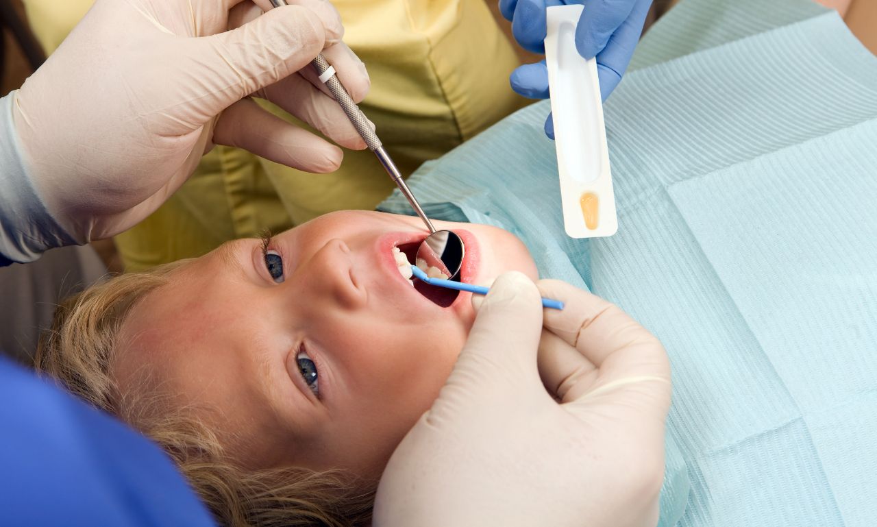 how do dentists clean toddler teeth